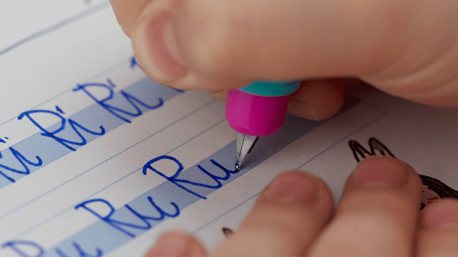 child practicing cursive