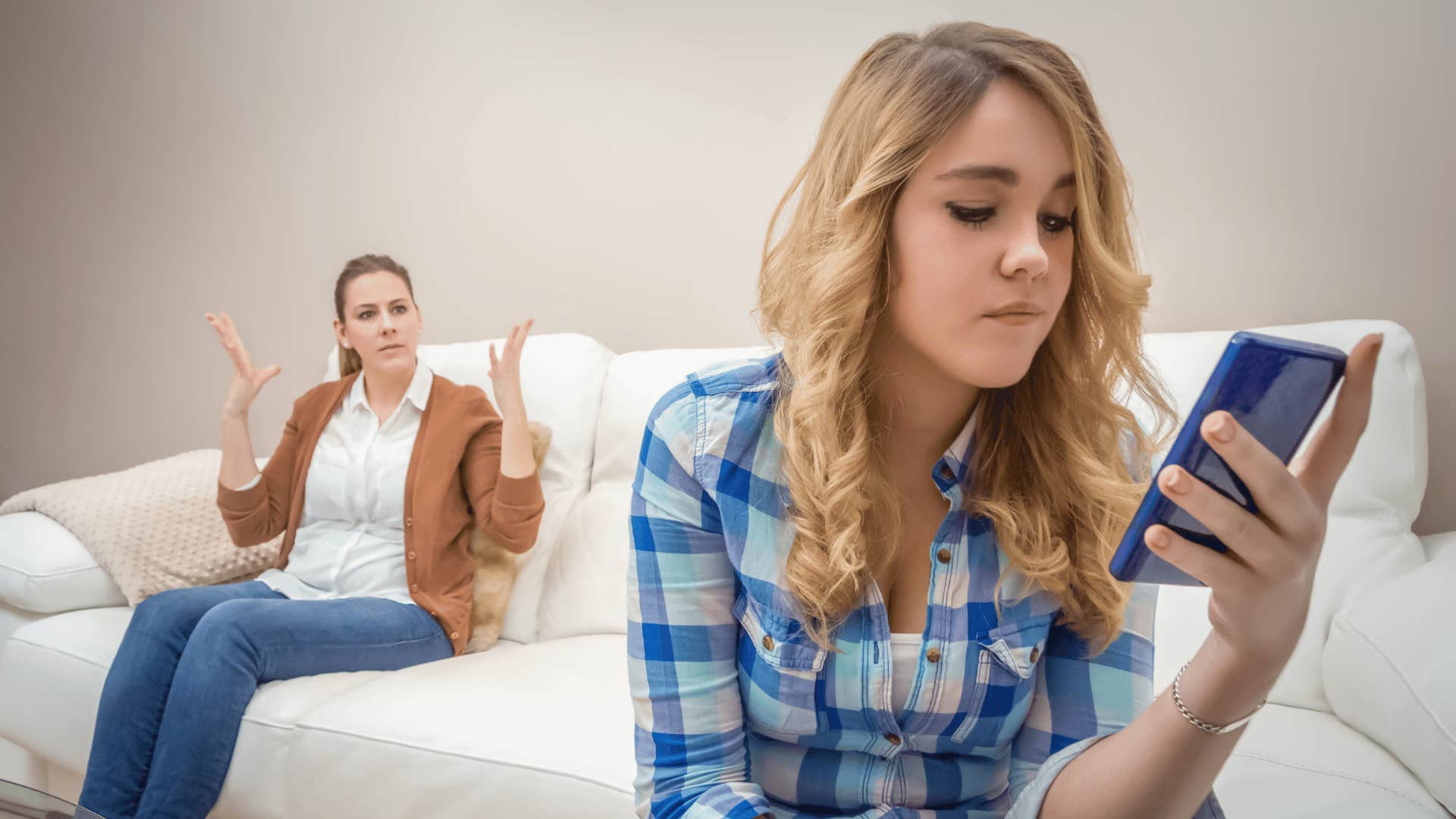 teenager on phone ignoring parent