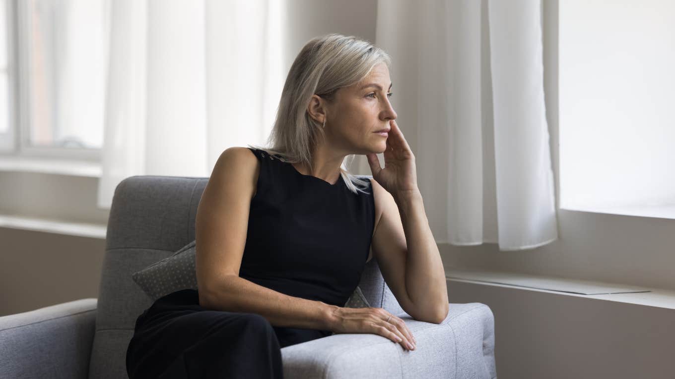 worried mom looking out window