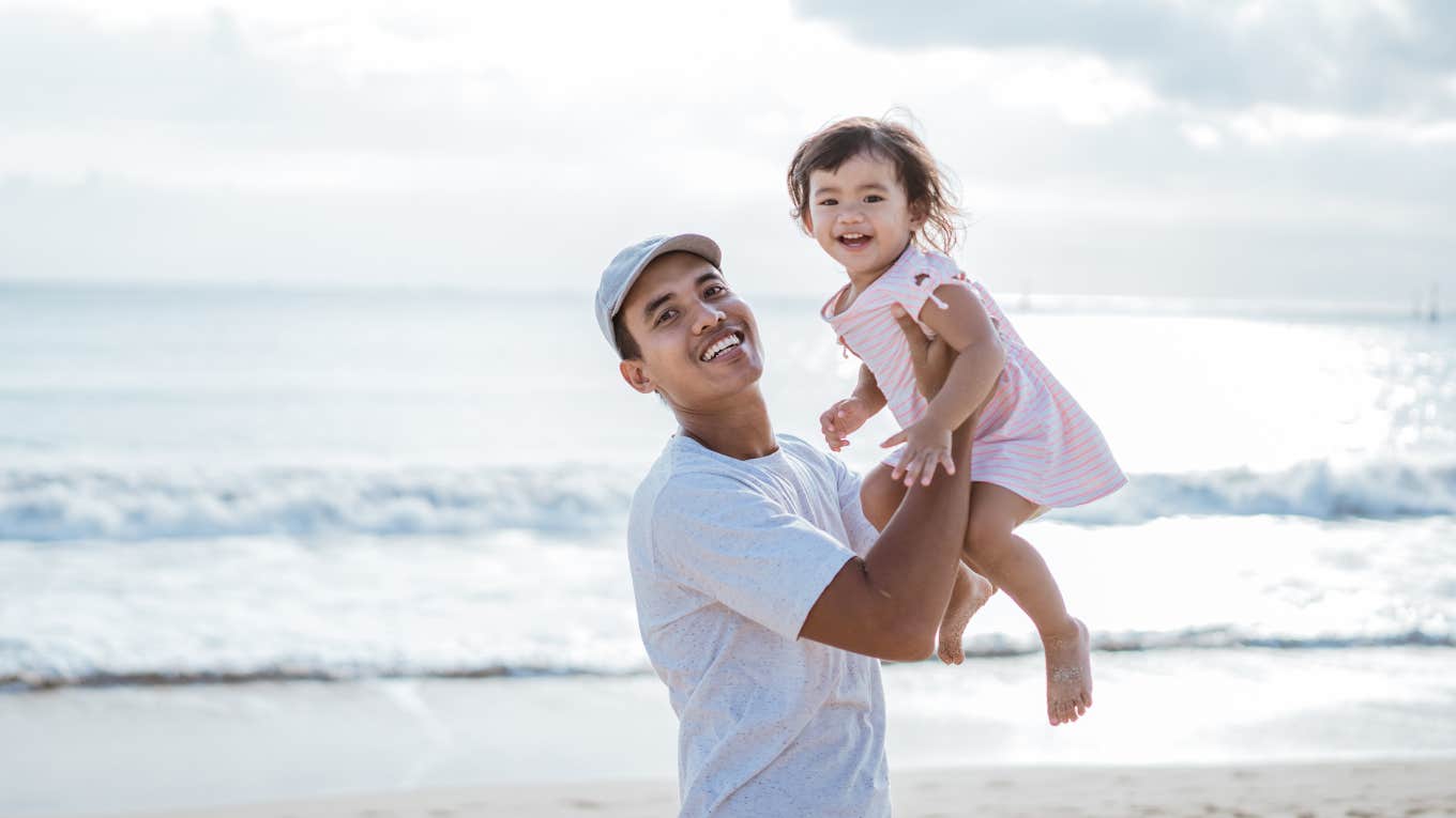 Dad and daughter at the beach for Dadurday tradition