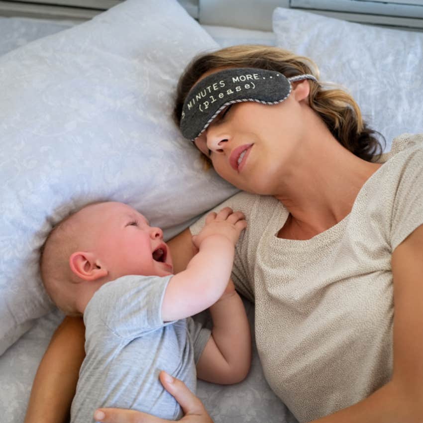 mom trying to sleep with crying baby 