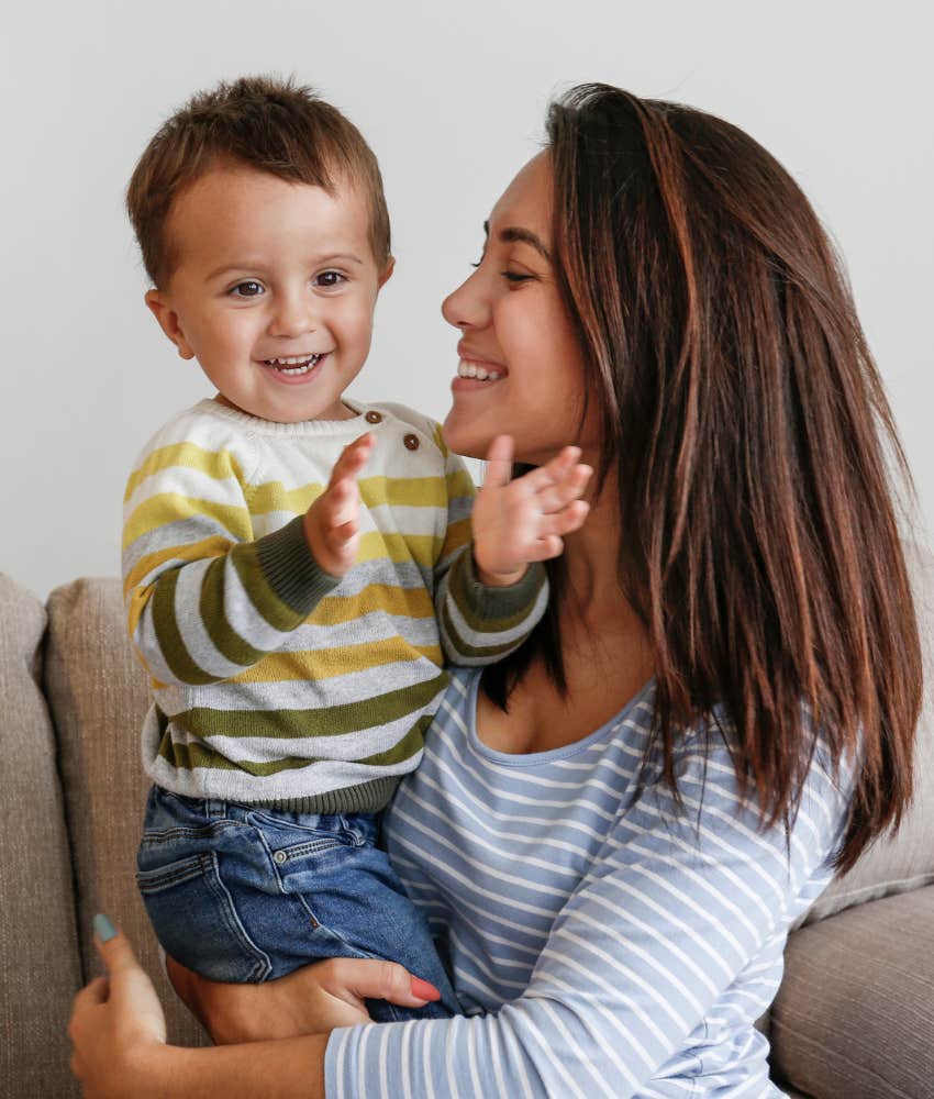 mom holding toddler son