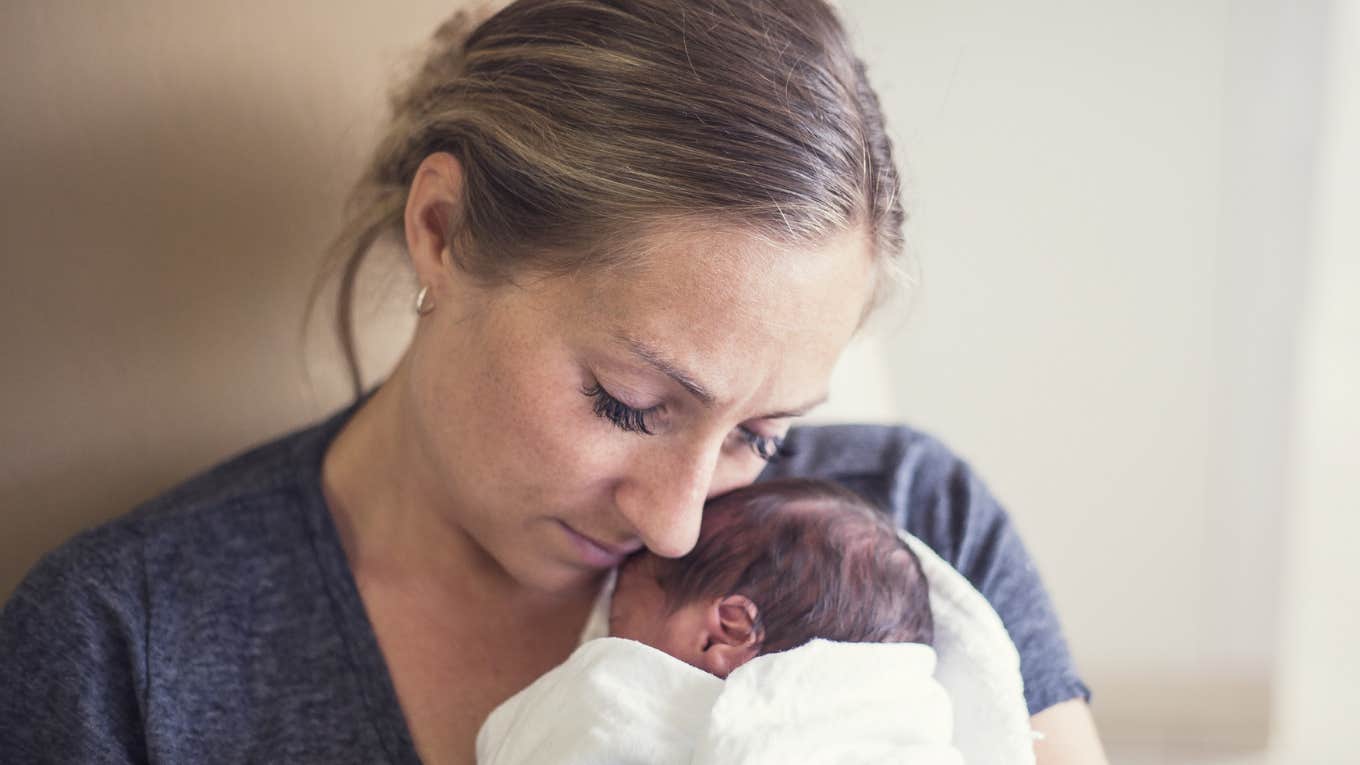 NICU mom hugging her baby