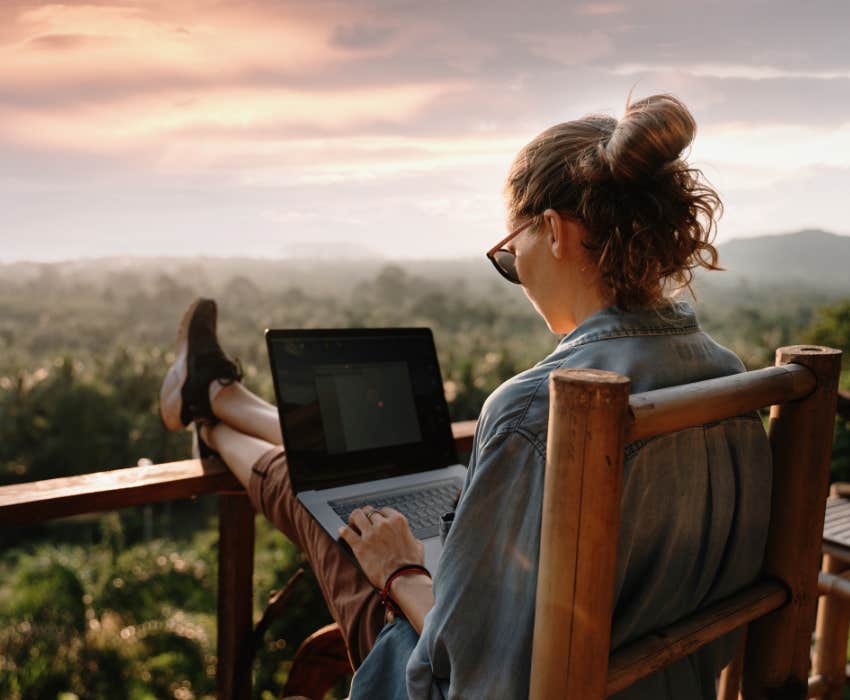 woman working remotely from her mobile device