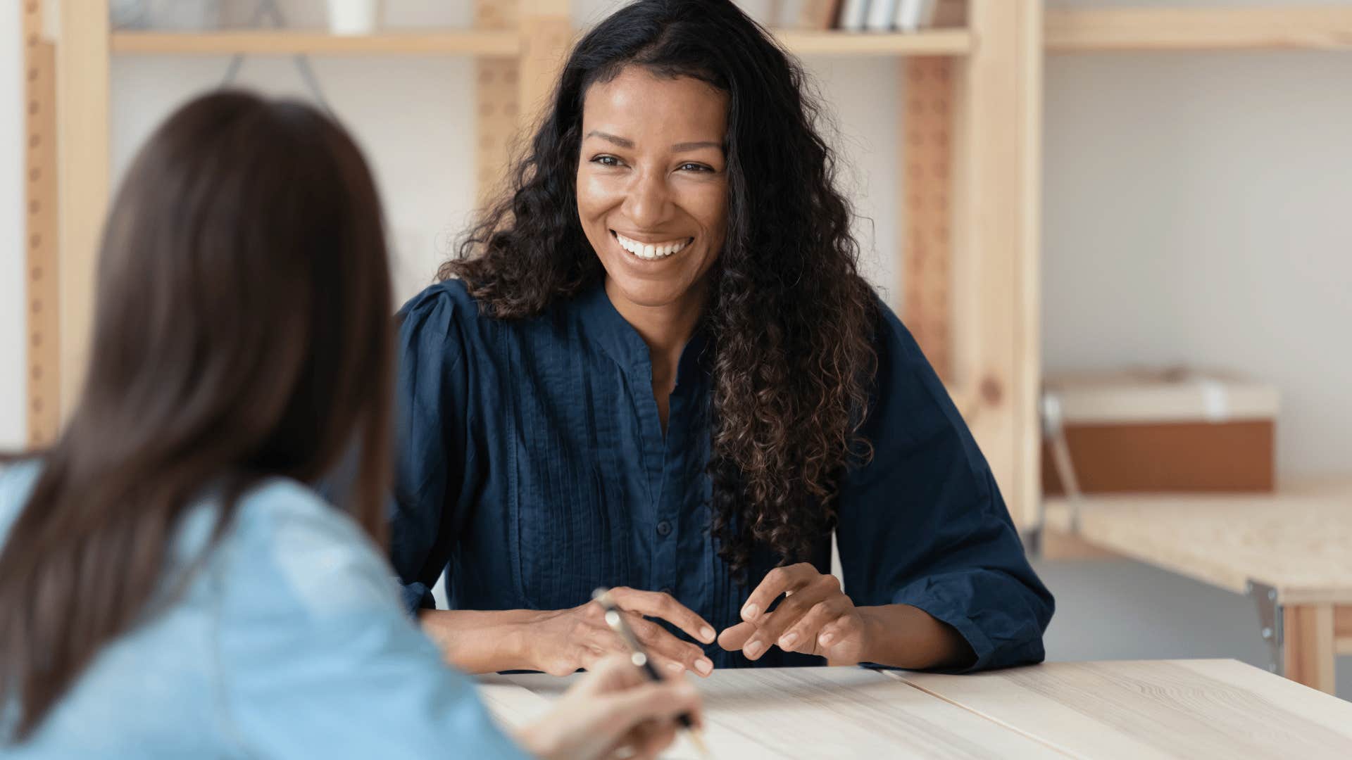 woman listening and smiling