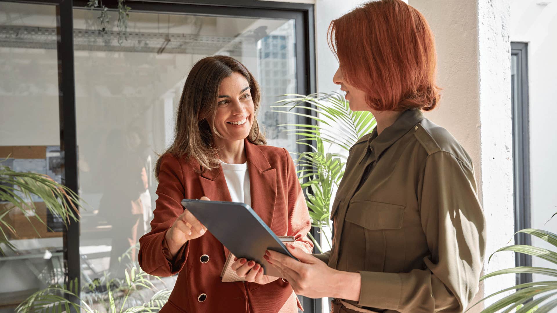 businesswomen talking to each other