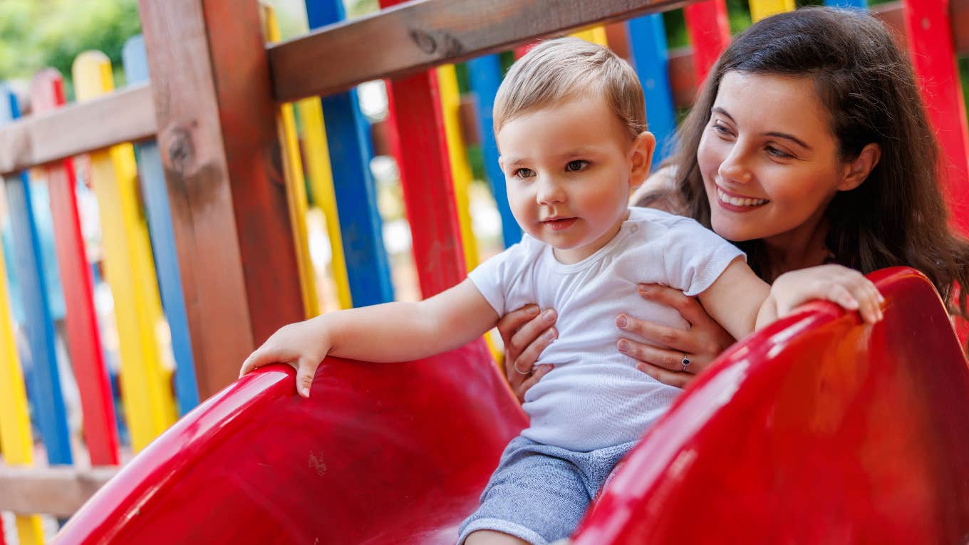 Nanny with her kid at the playground