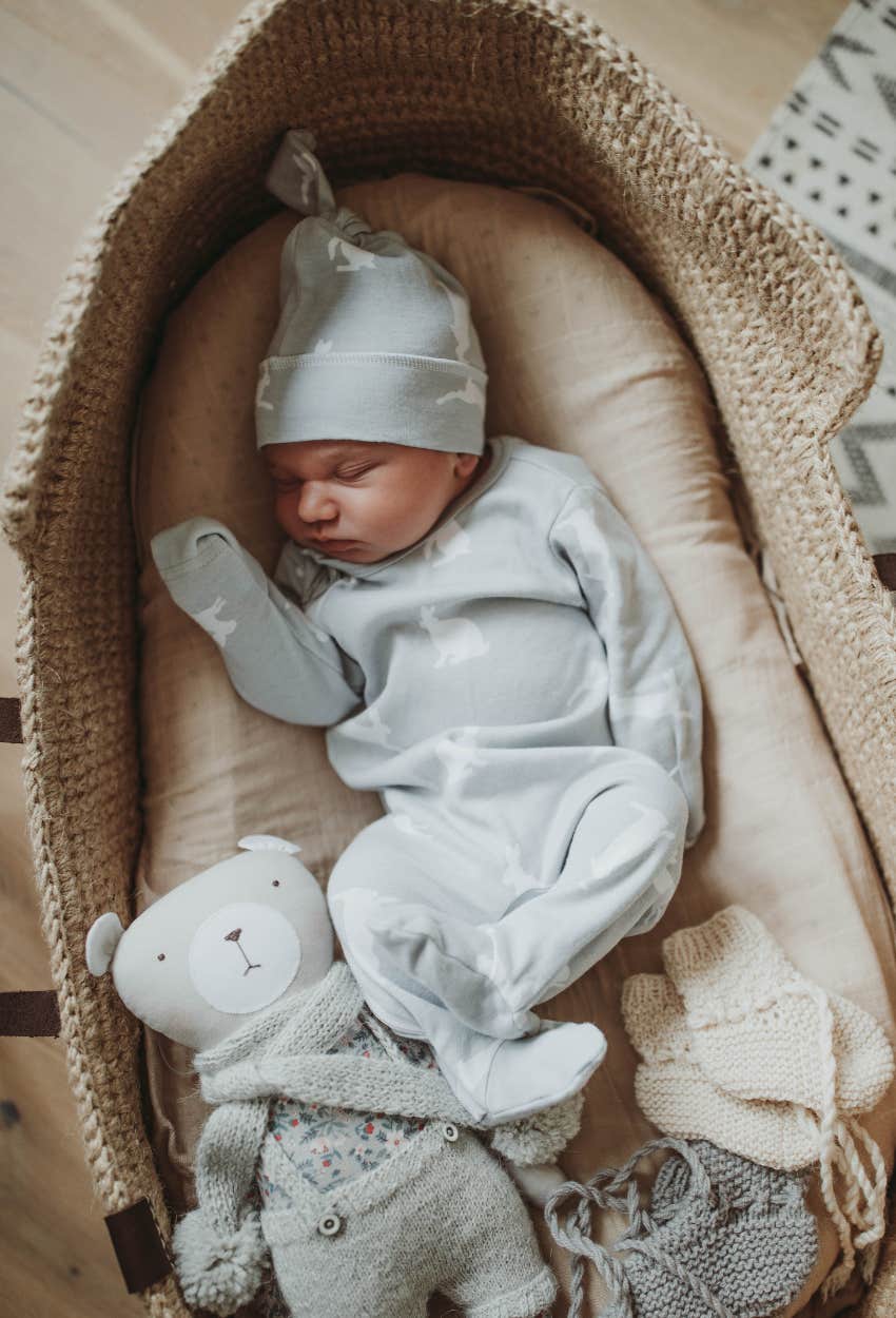 newborn in a basinet