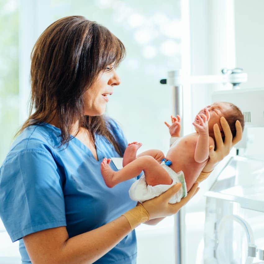 nicu nurse caring for baby