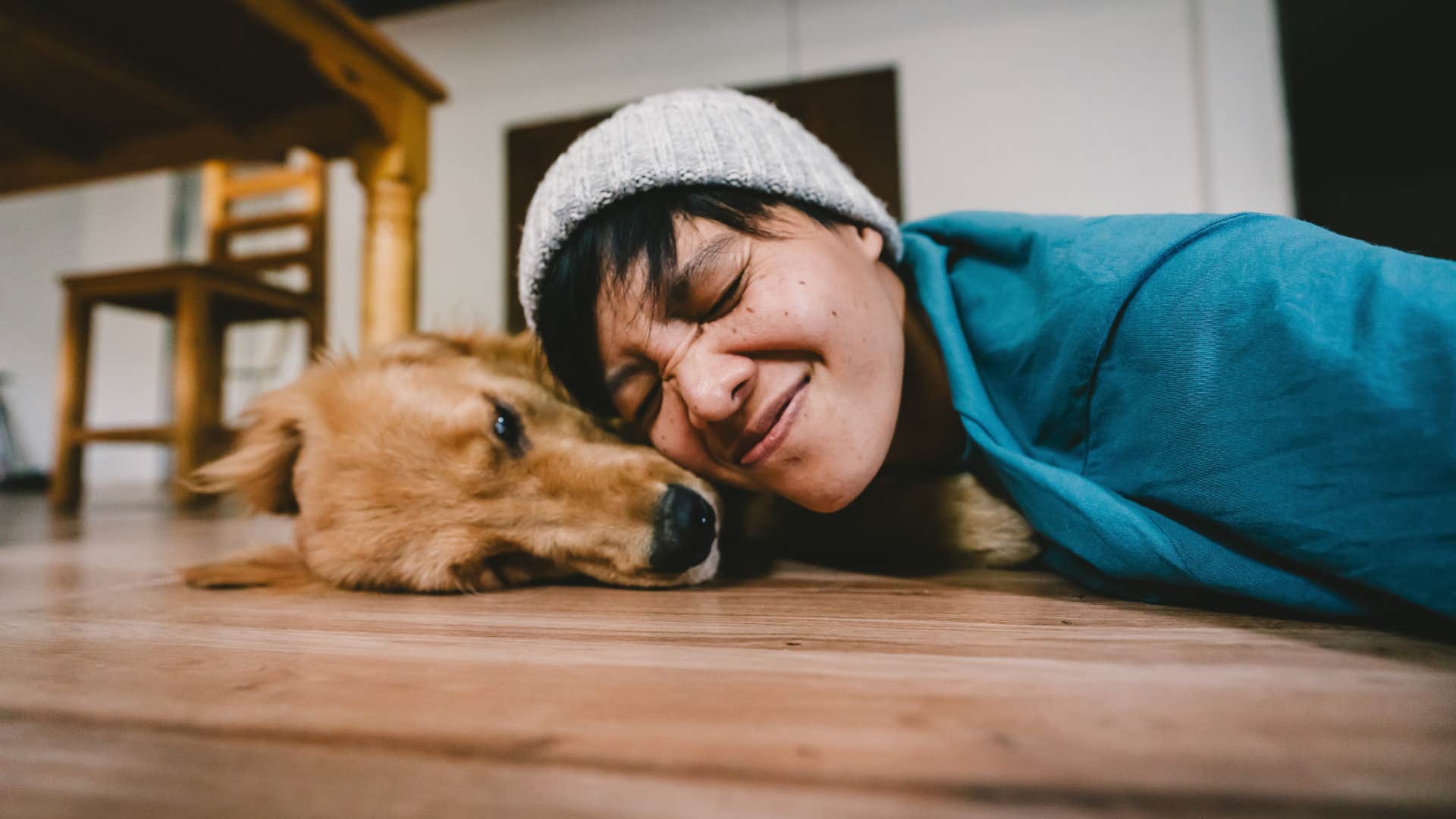 dog is licking its owner's face.