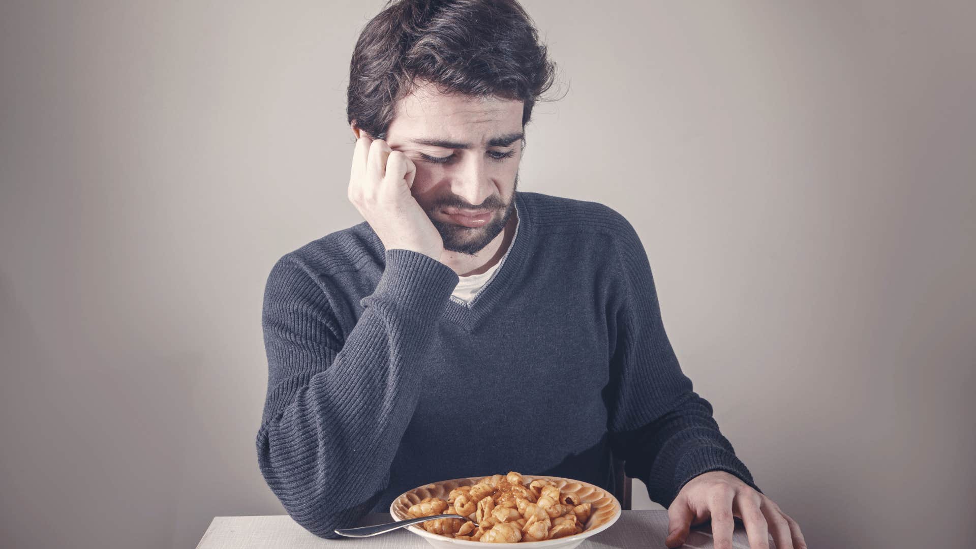 man not eating his food