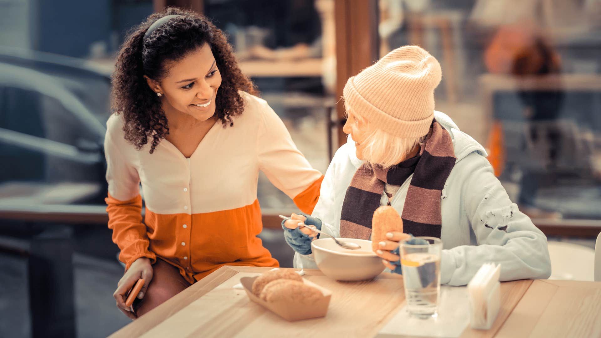 compassionate woman helping another woman