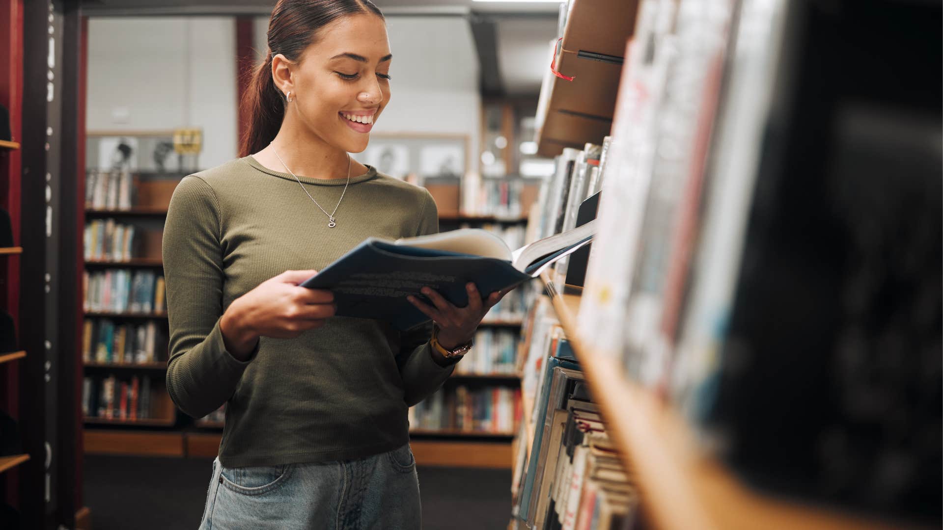 curious woman reading in the library