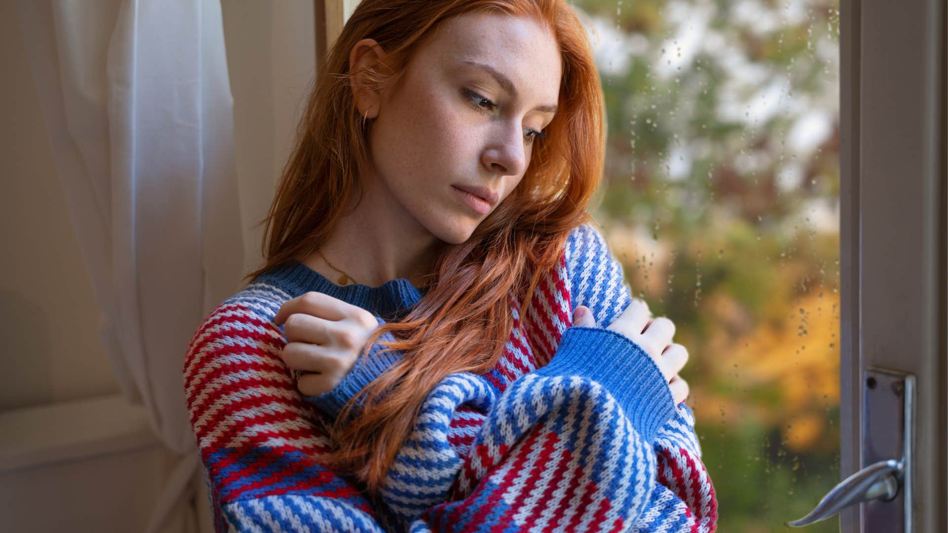 sensitive woman looking outside