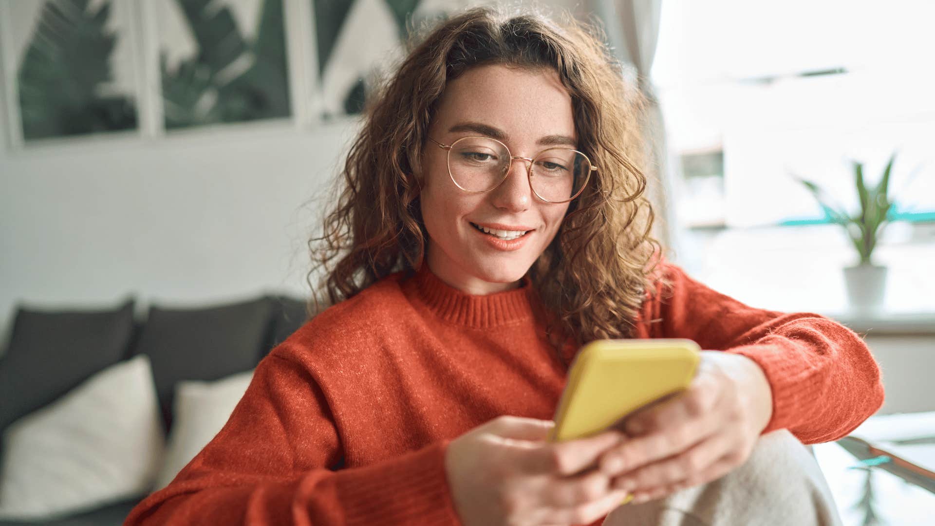 woman looking at her phone