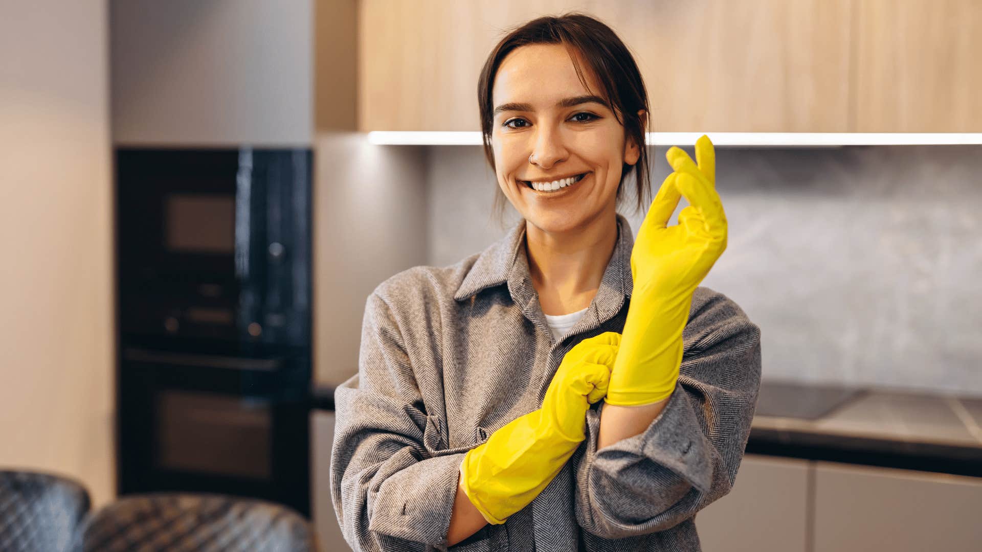 woman putting on gloves