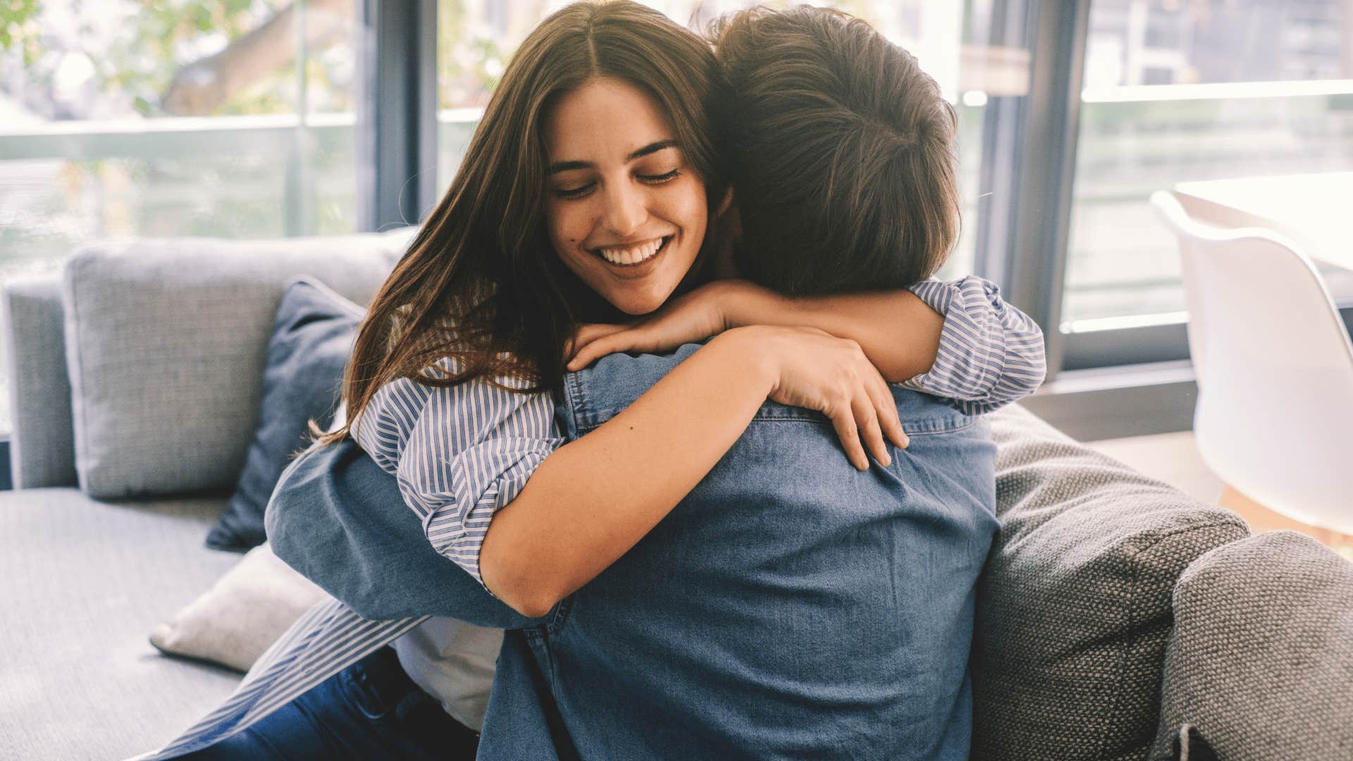 man and woman hugging