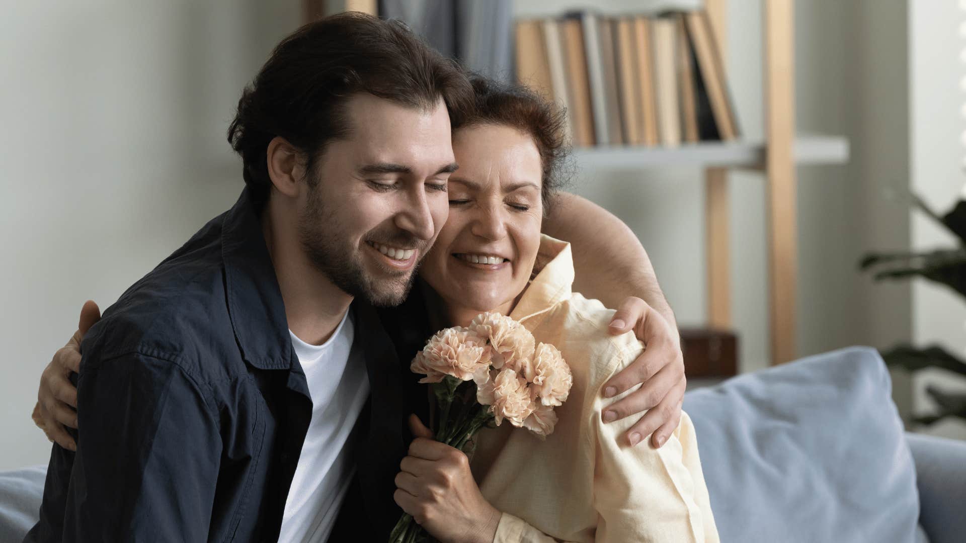 son and mom hugging