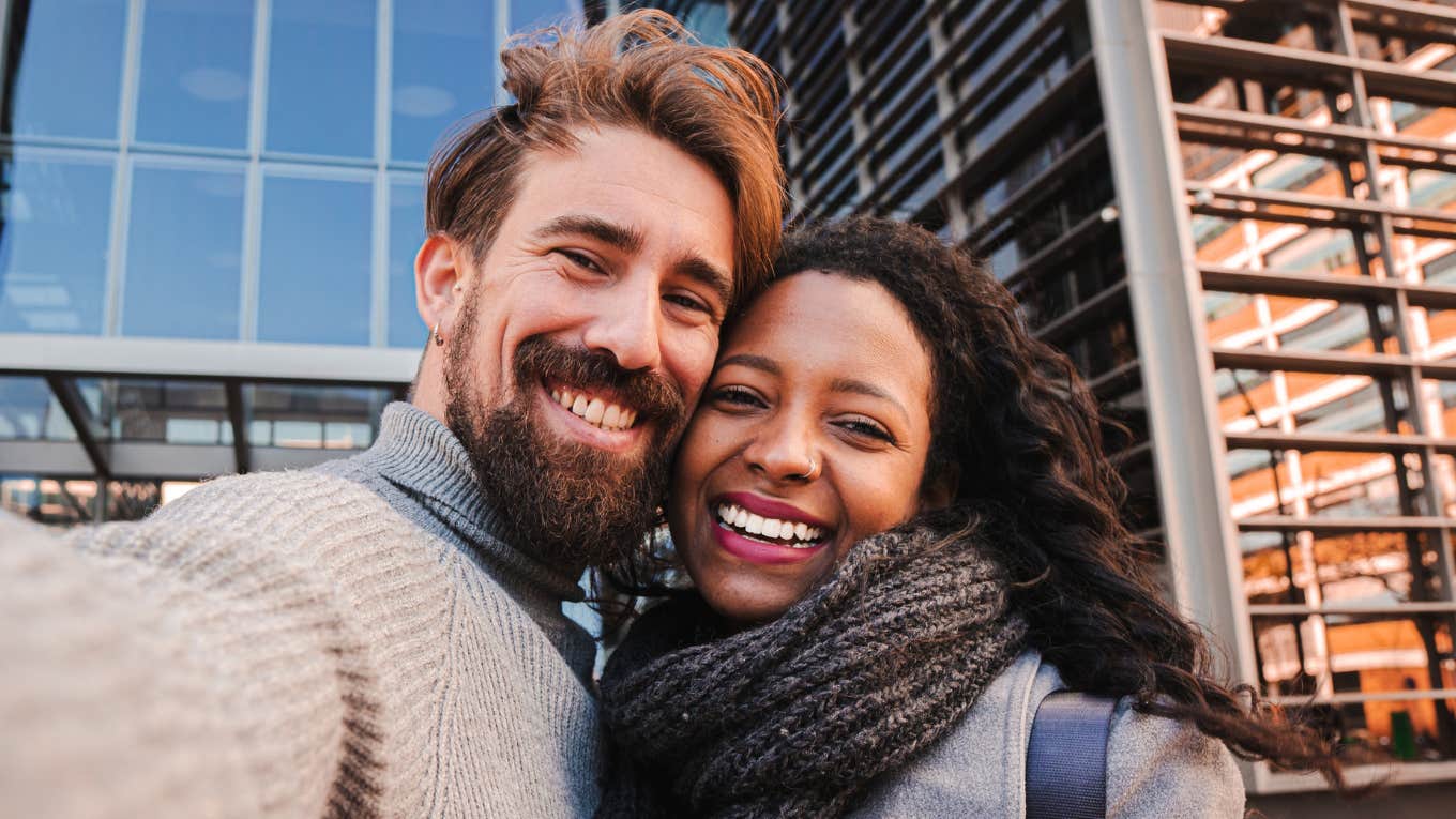 Young man and woman tourist making selfie and smile to the camera.