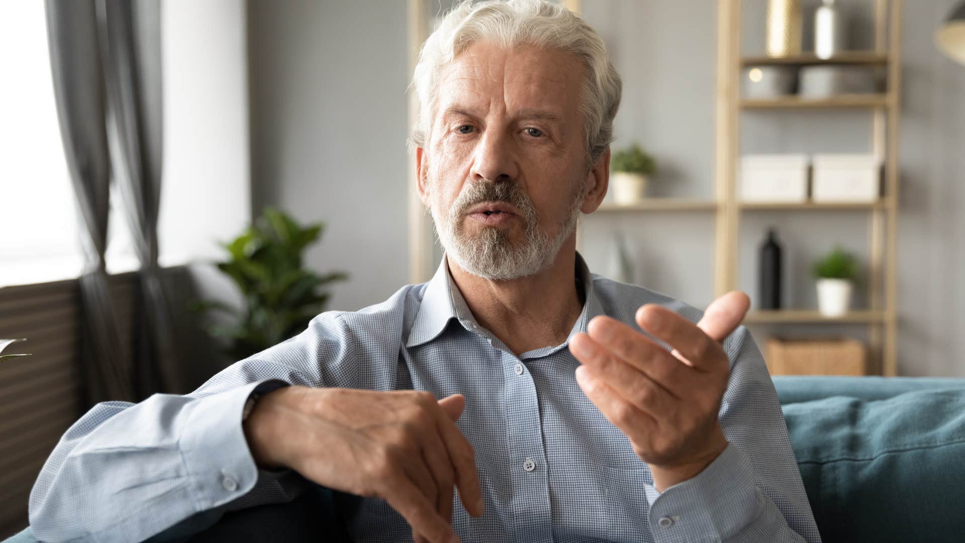 Boomer man looking annoyed talking to someone