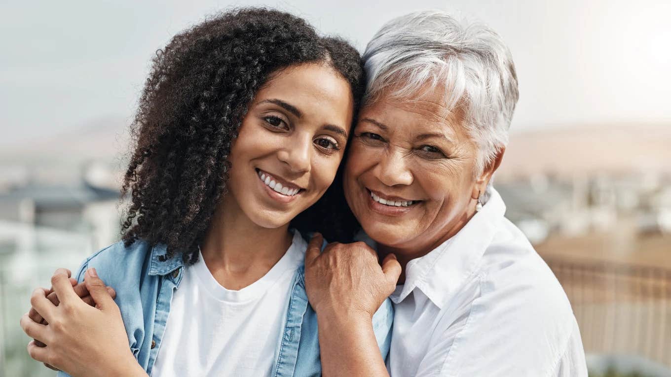 mom and daughter smiling and hugging