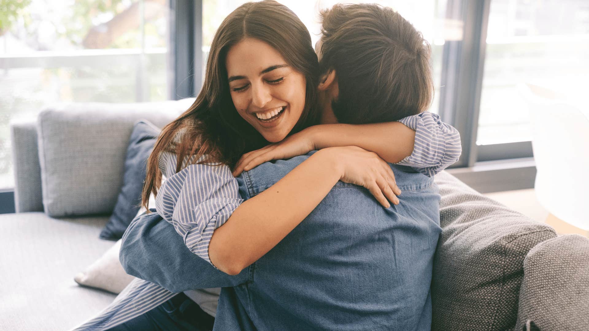 couple hugging on couch