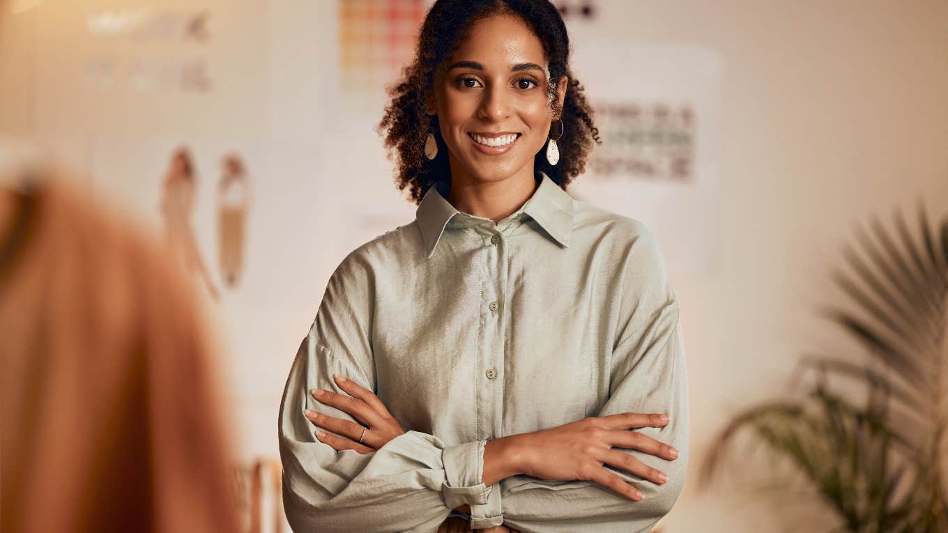 smiling woman standing in her office