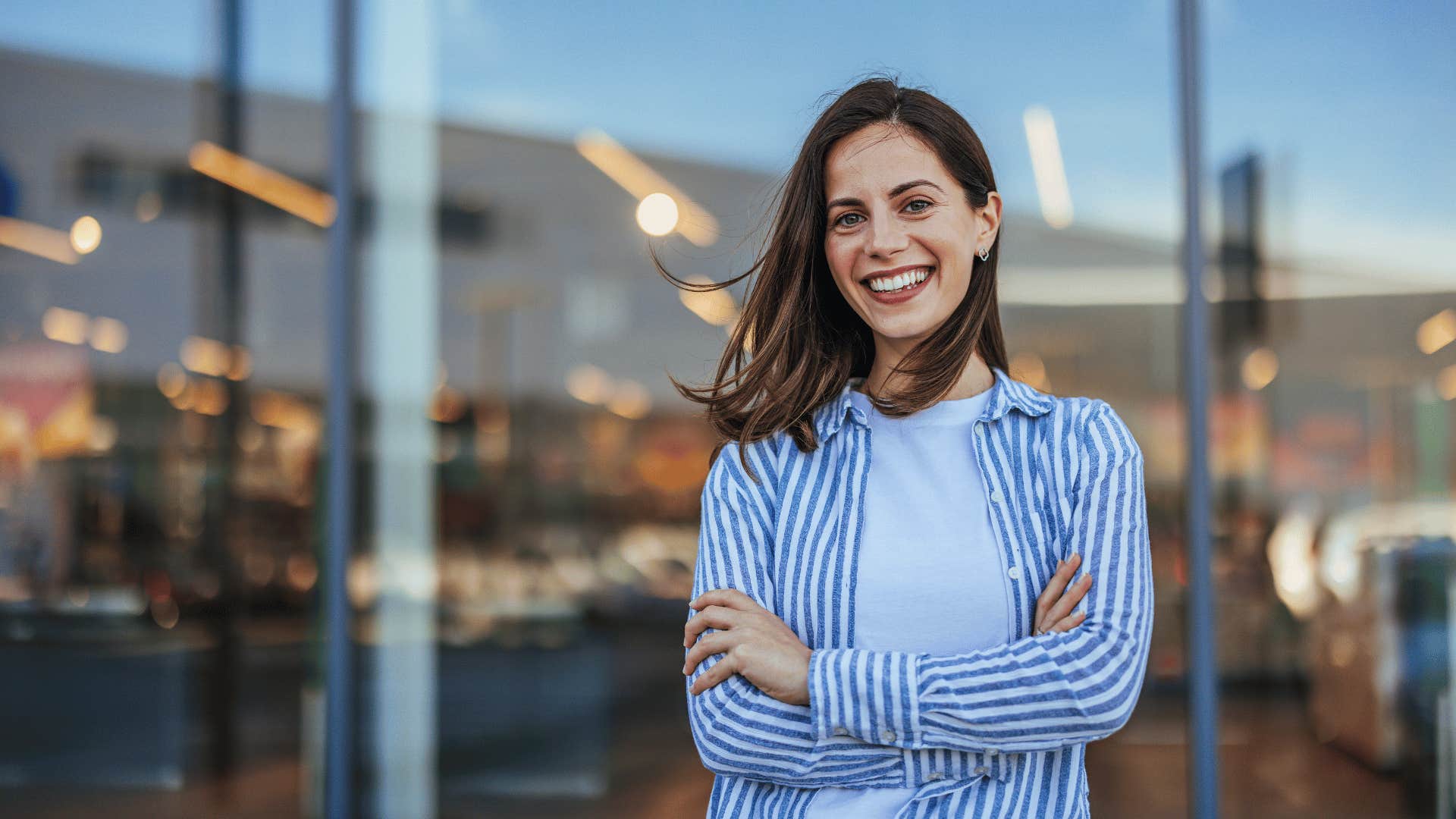 woman smiling outside building