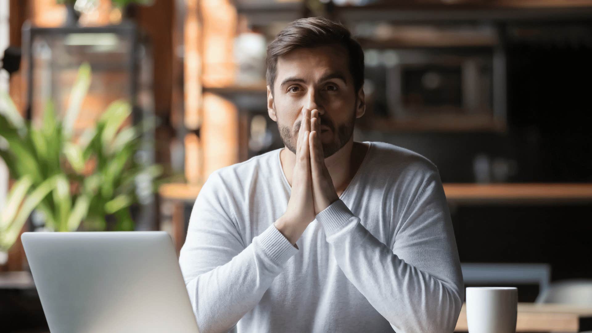 frustrated man in front of laptop