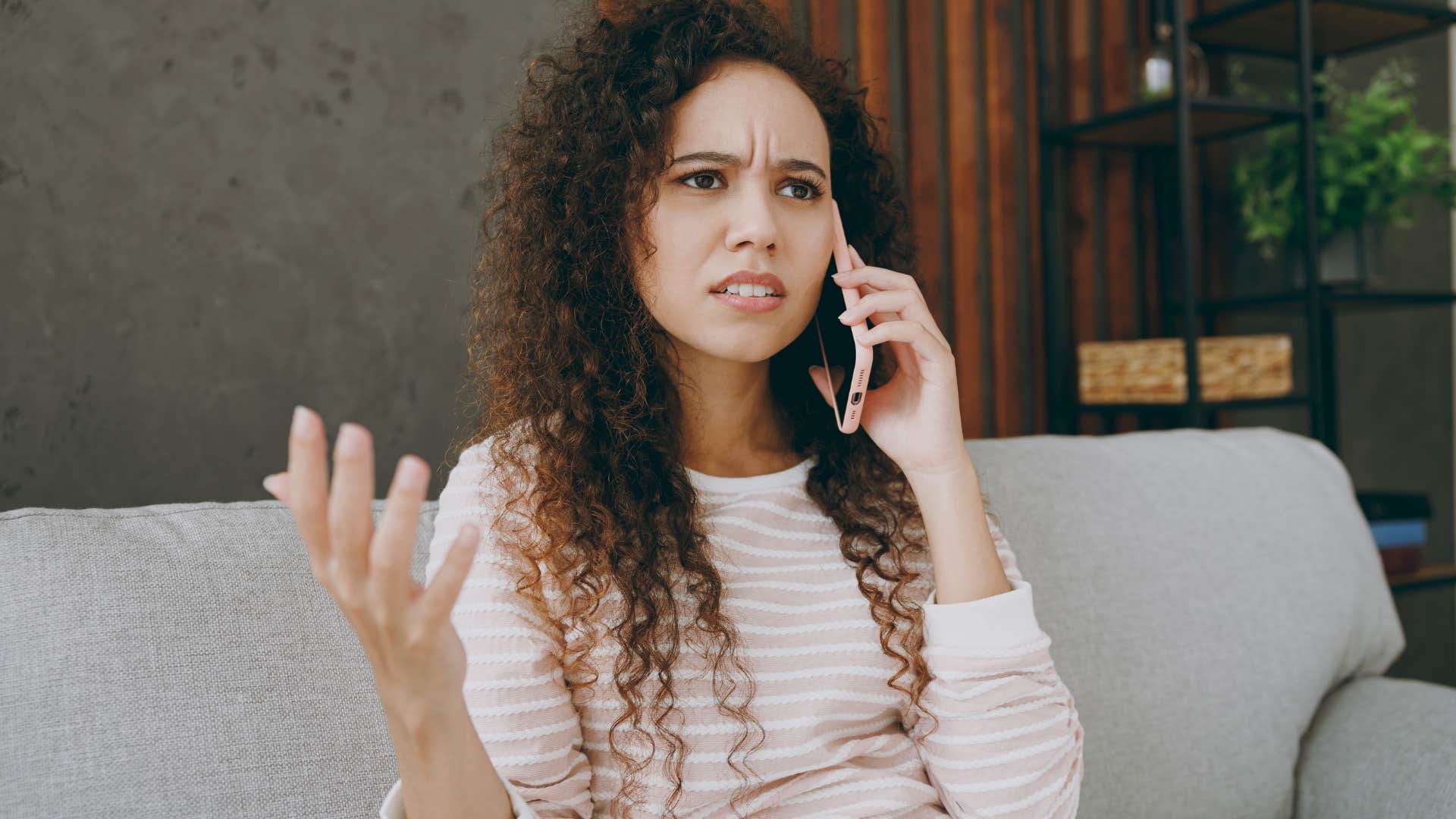 Annoyed woman talking on the phone