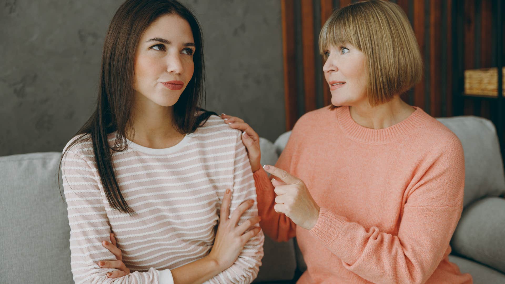 Woman gossiping with her mother on the couch