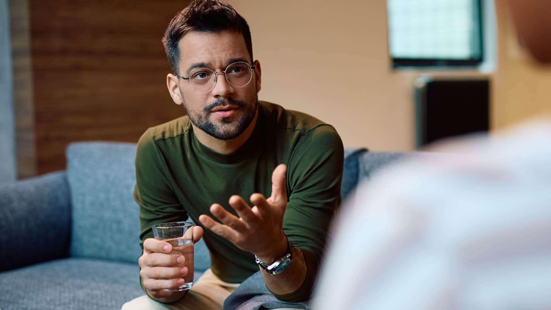 Man talking to another person with his hands