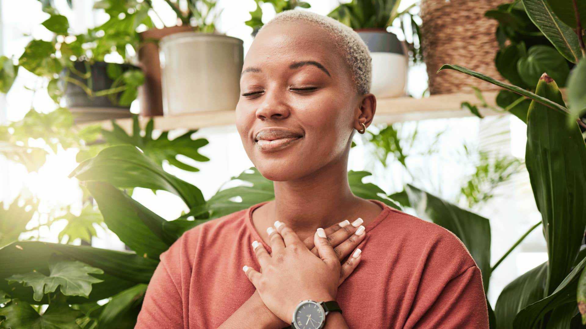 woman meditating while smiling