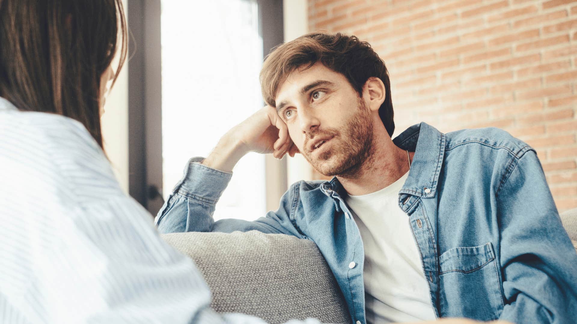 man listening to woman