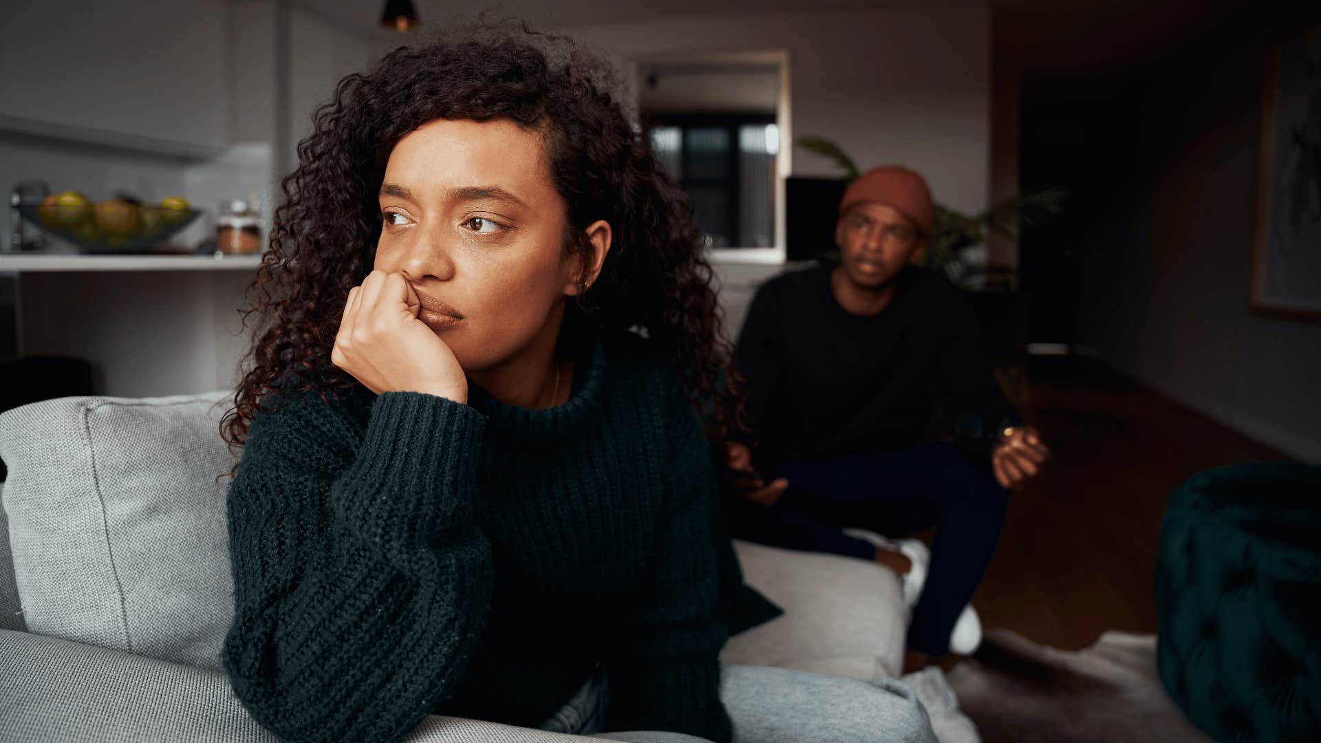 woman ignoring man while he continues to argue