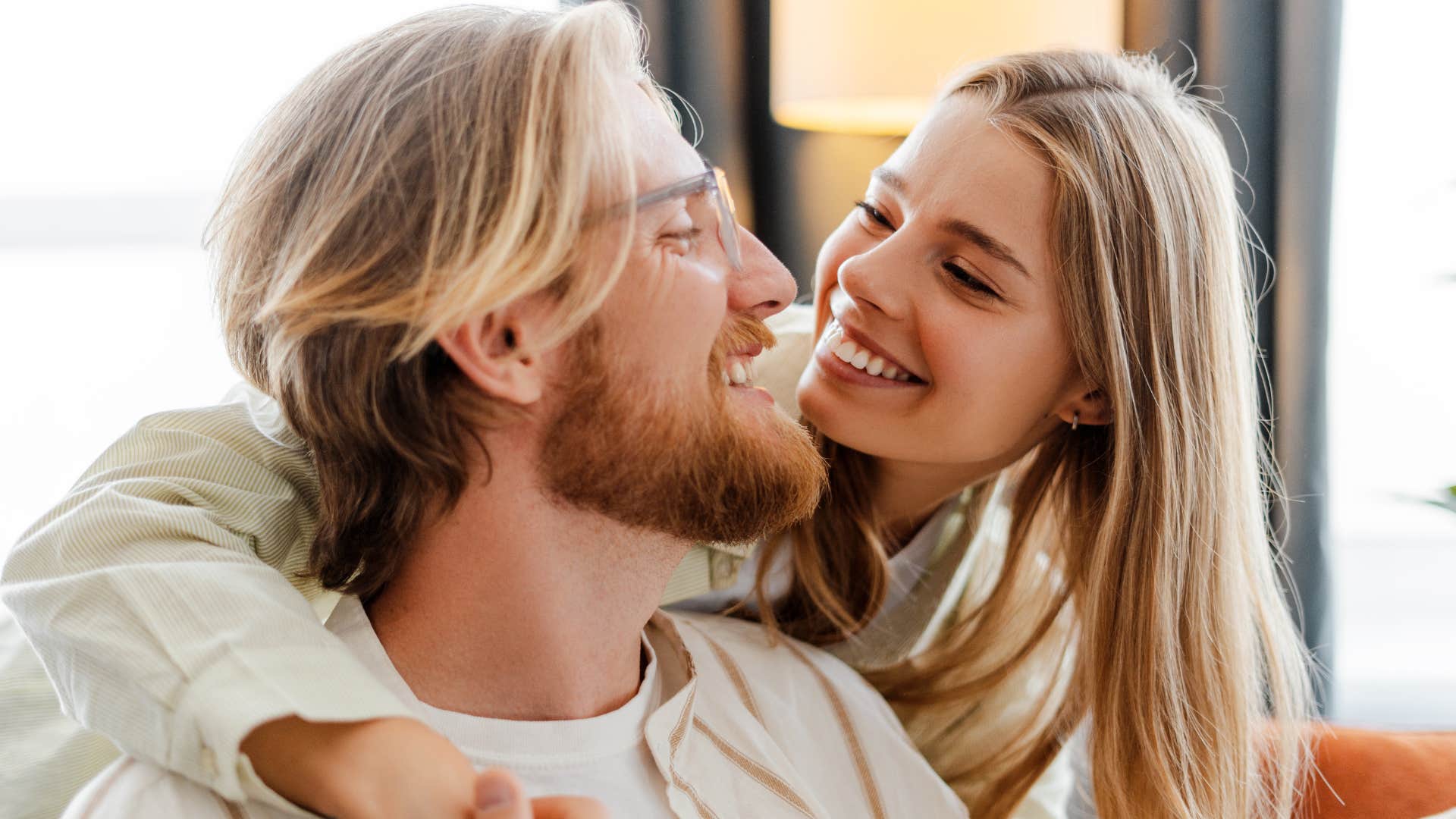 man and woman hugging