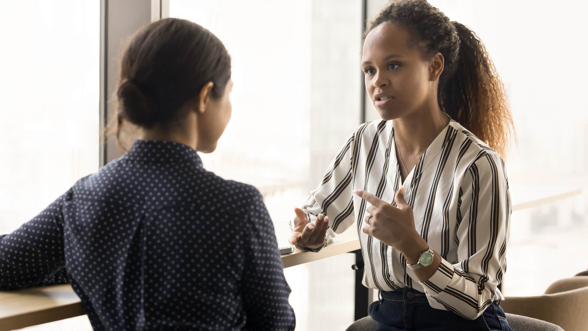 women talking in office