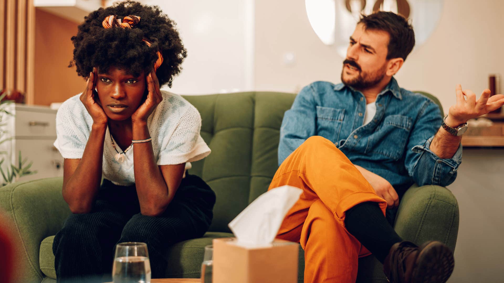 sad woman zoning out while man talks to her