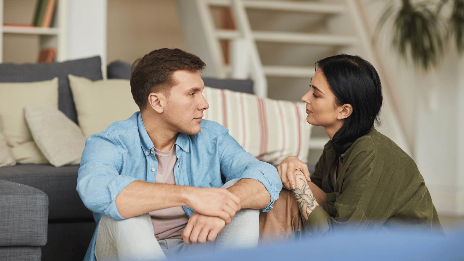 couple sitting on the floor deep in conversation