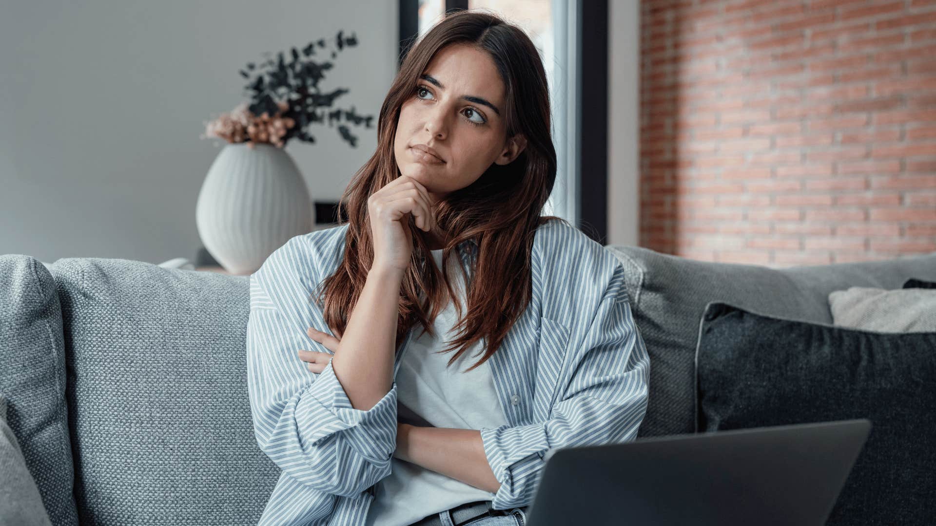 woman thinking while working