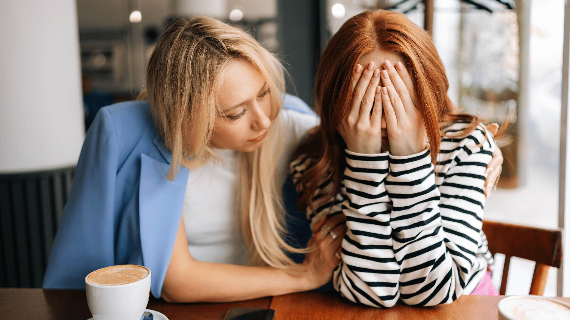 woman comforting friend