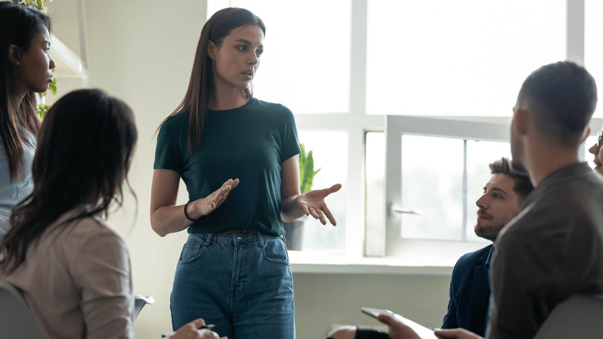 woman explaining something to group