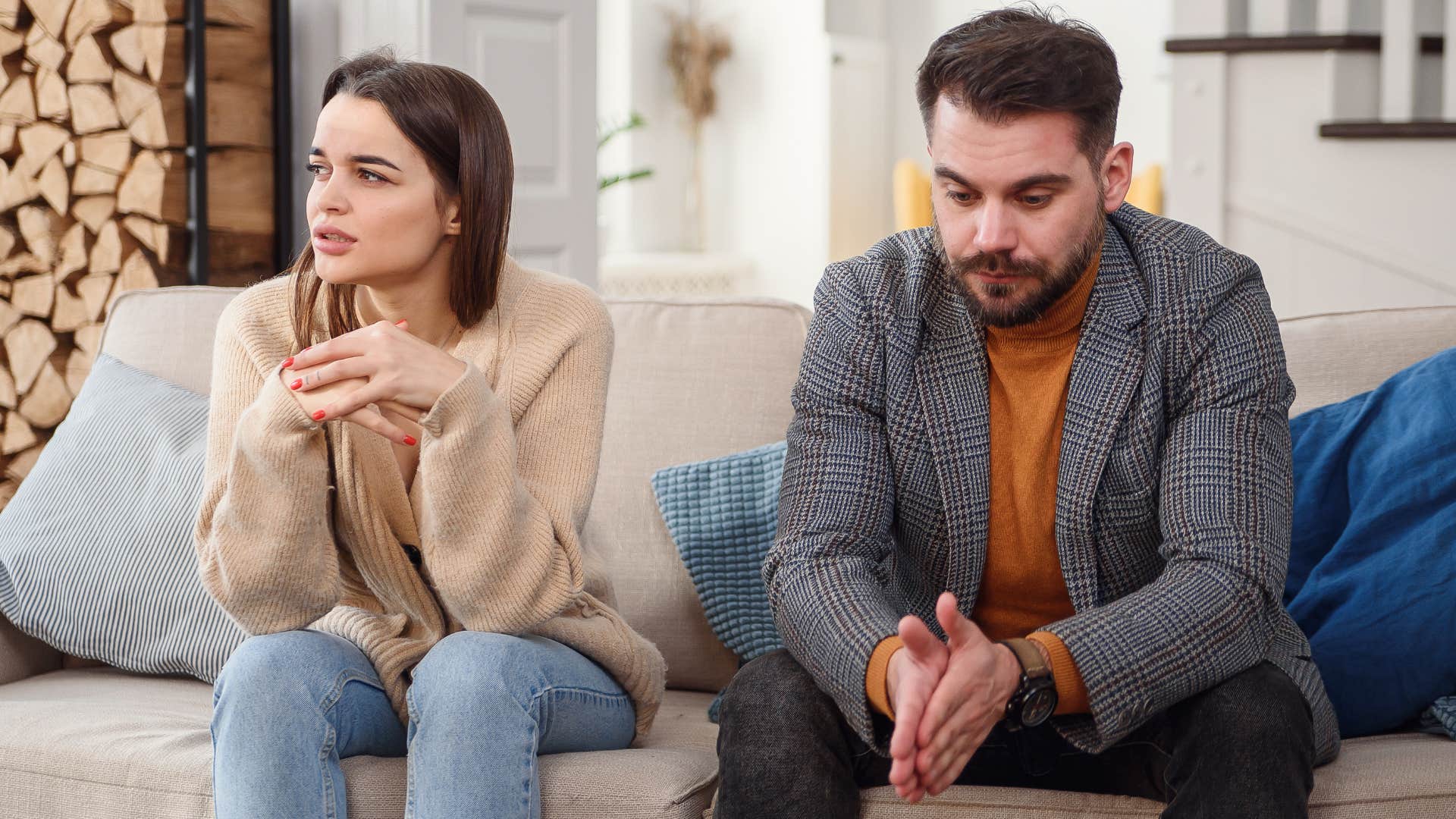 couple looking annoyed turned away from each other