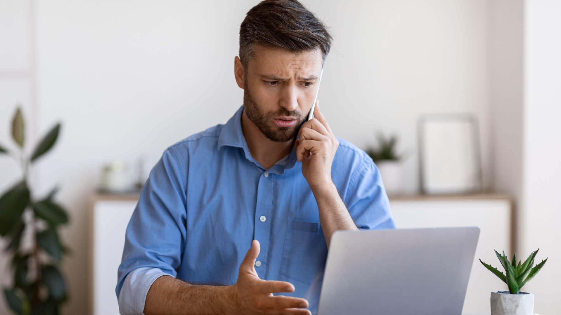 Man talking on the phone looking annoyed