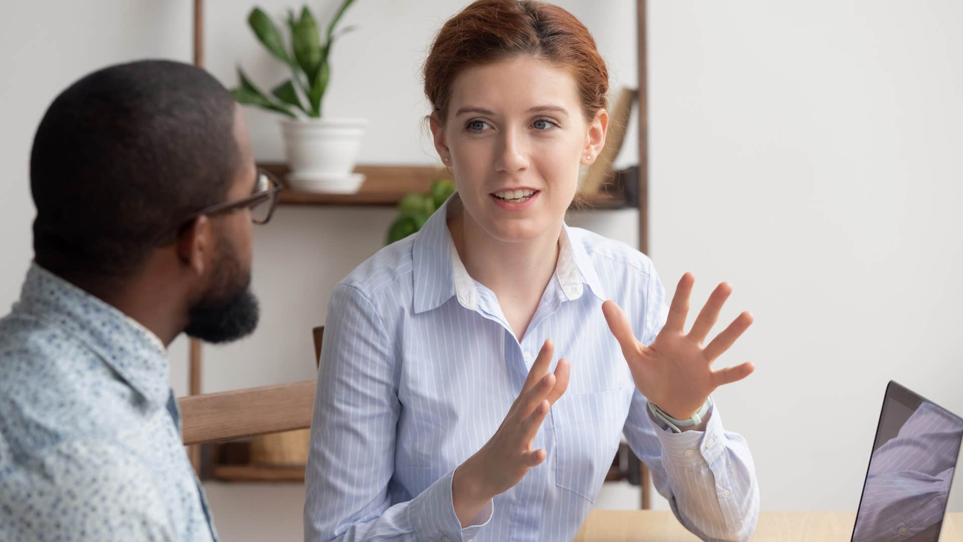 Woman speaking to her co-worker