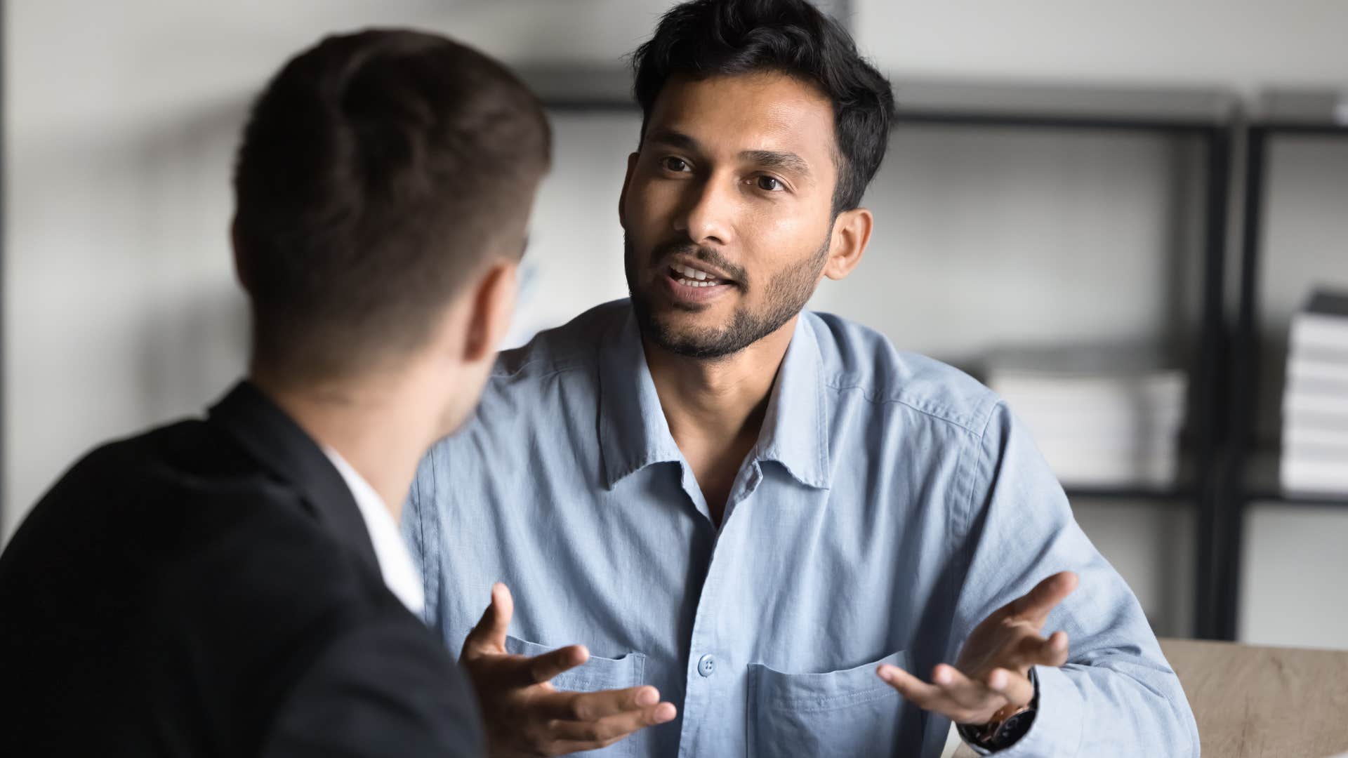 Man speaking to his co-worker