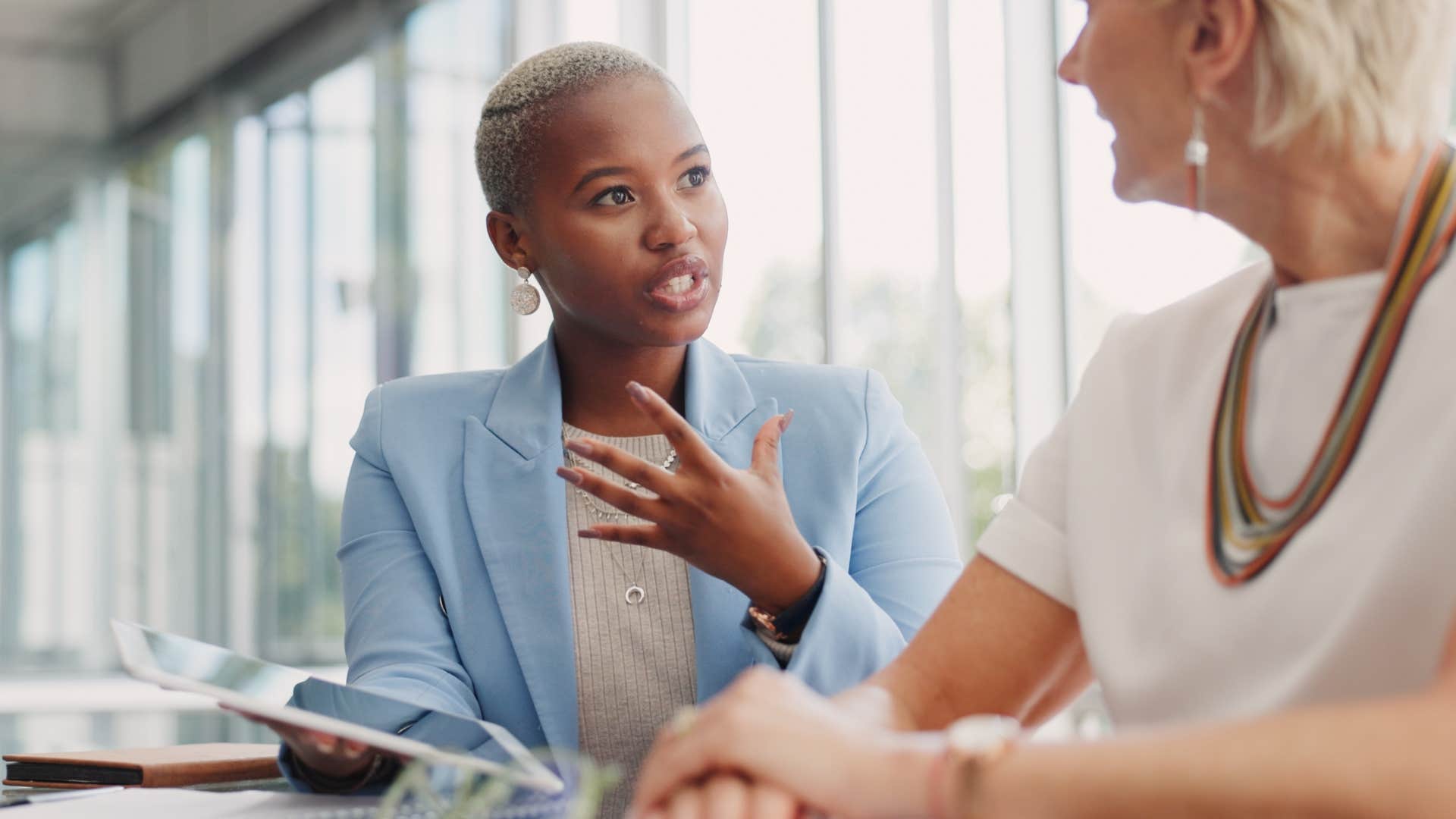 Woman talking to her co-worker in an office