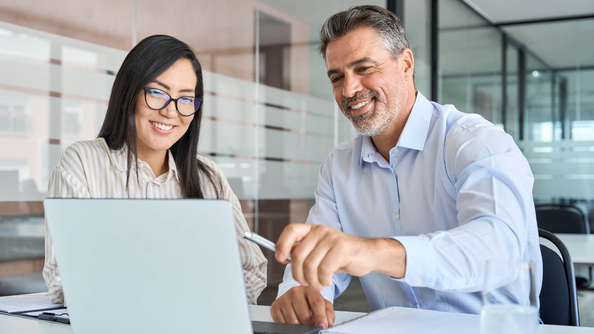 Man speaking to his co-worker in an office