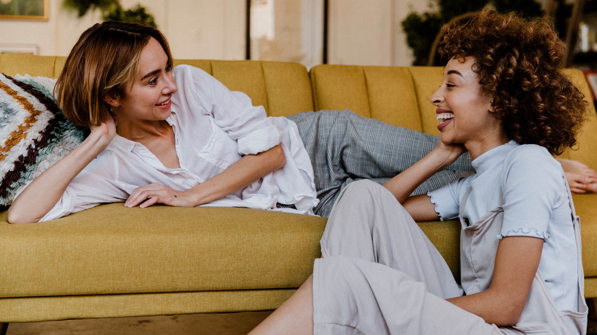 Two women talking to each other and smiling