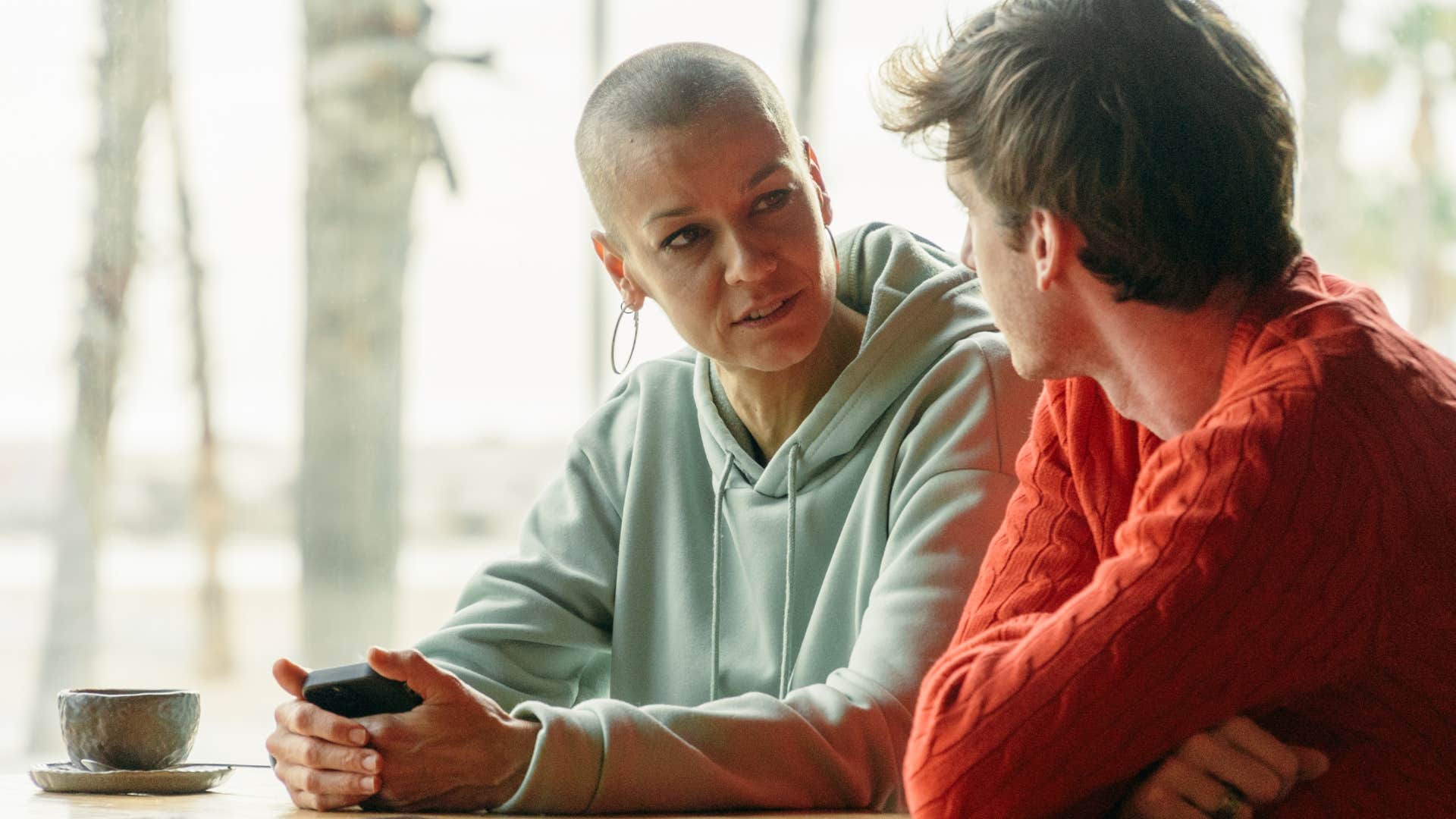 Woman having a serious conversation with her teenage son.